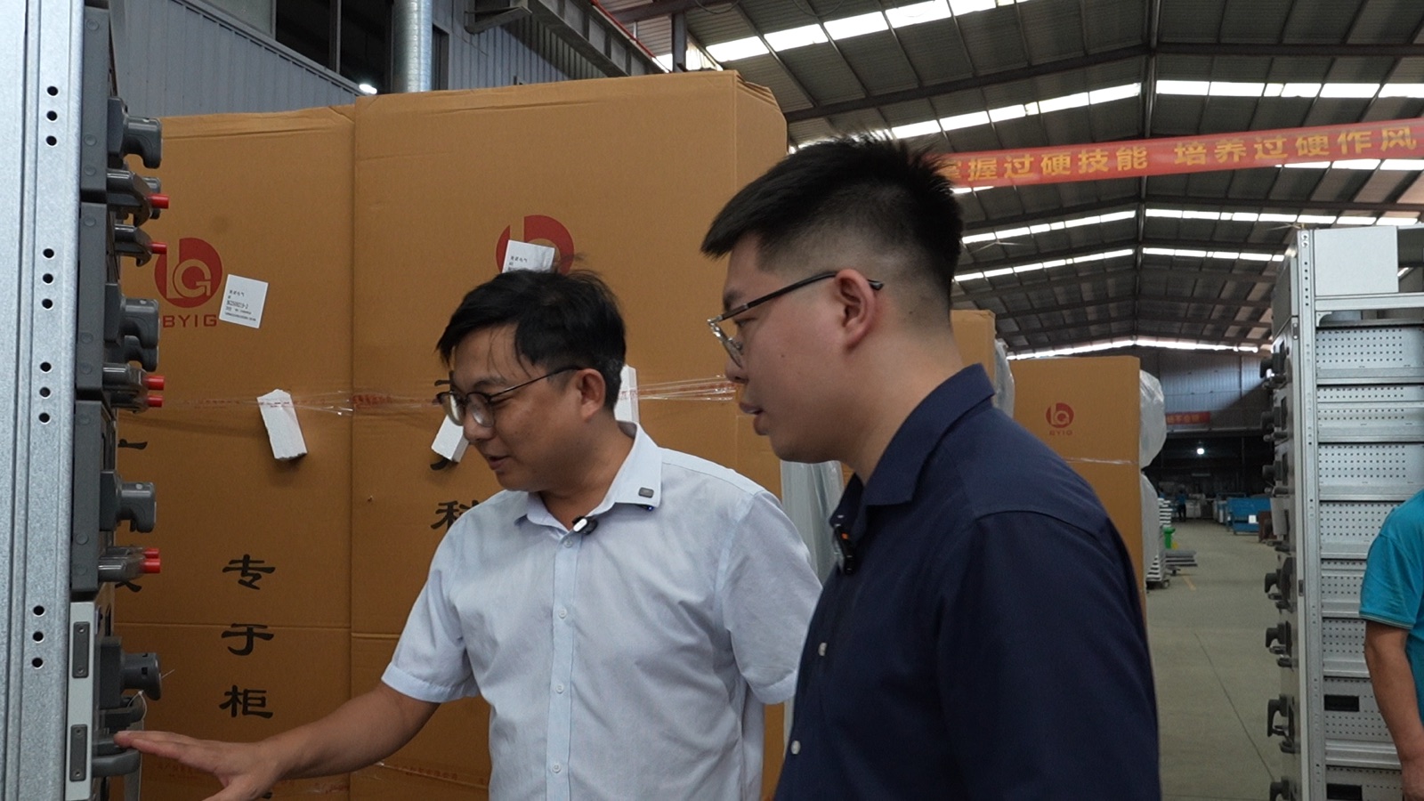 The Rich Bee founder inspecting goods with a supplier on the factory floor